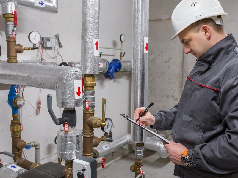 Man checking pipes